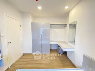 Modern bedroom with sleek wardrobe and minimalist design