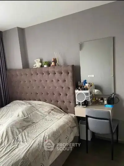 Cozy bedroom with stylish headboard and vanity setup