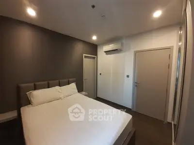 Modern bedroom with stylish decor and air conditioning unit