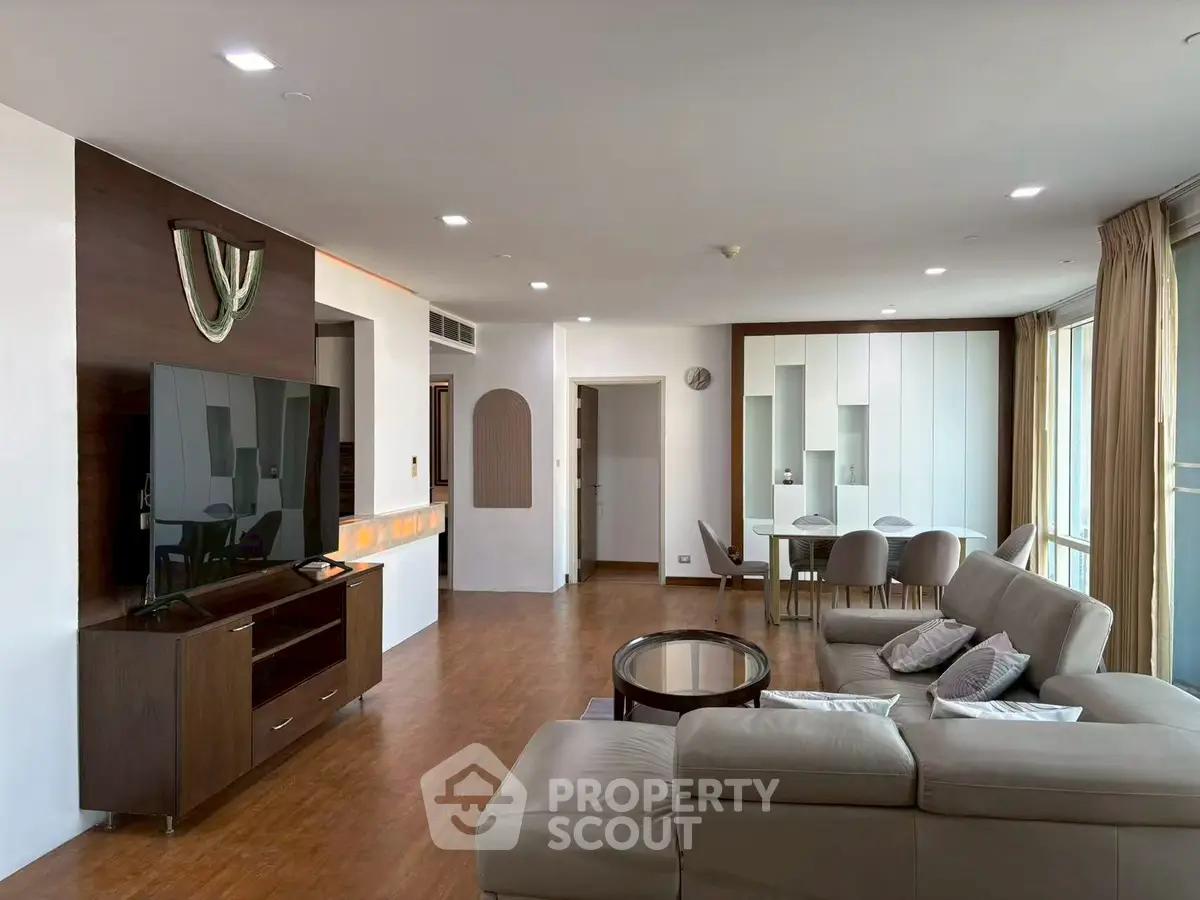 Spacious modern living room with sleek furniture and large windows