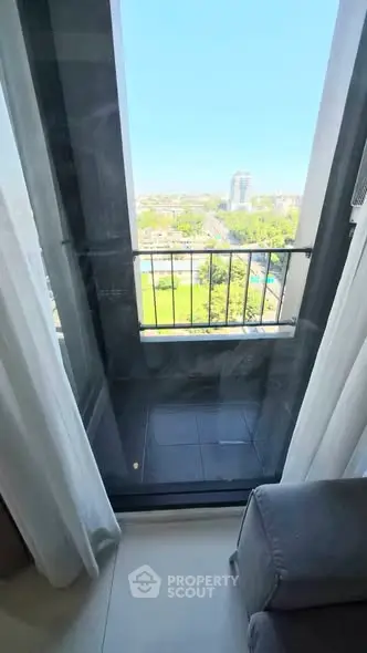 Charming balcony with stunning city view, perfect for relaxation and enjoying the outdoors.