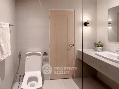 Modern bathroom with sleek fixtures and neutral tones