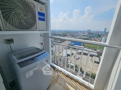 High-rise balcony with washing machine and city view, perfect for urban living convenience.