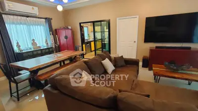 Spacious living room with modern furniture and open kitchen layout