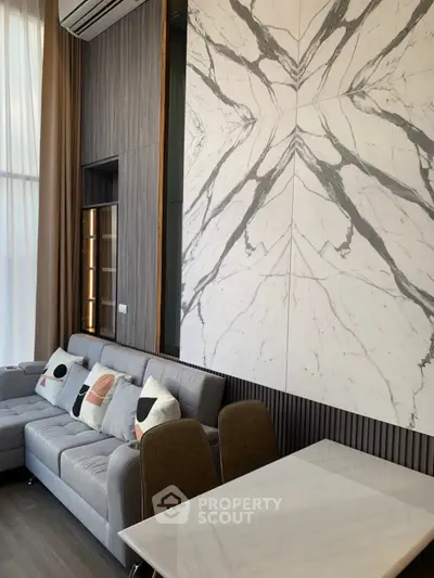 Luxurious modern living room with marble accents and stylish furniture