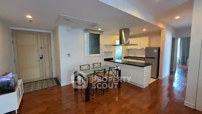 Modern open-layout kitchen with dining area and sleek appliances