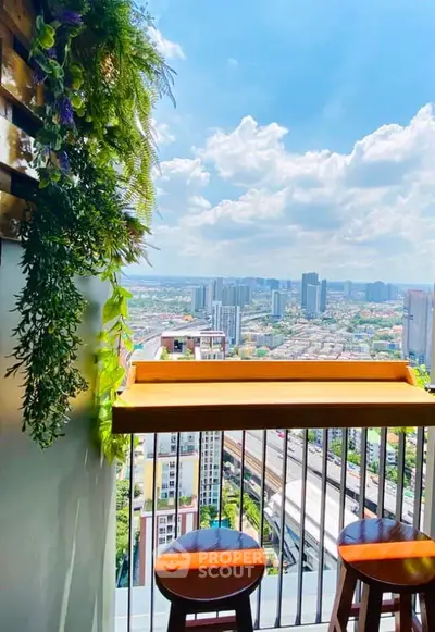 Stunning balcony with panoramic city view and stylish seating