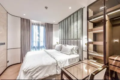 Luxurious bedroom with elegant decor and ample natural light