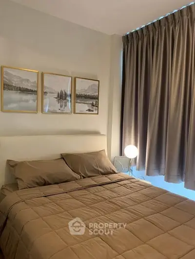Cozy bedroom with elegant decor and soft lighting, featuring a comfortable bed and stylish curtains.