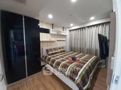 Modern bedroom with stylish decor and ample storage space