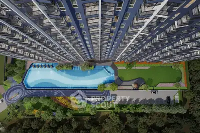 Stunning aerial view of modern high-rise building with luxurious pool and landscaped garden.