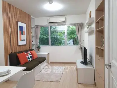 Modern living room with stylish decor and large window view