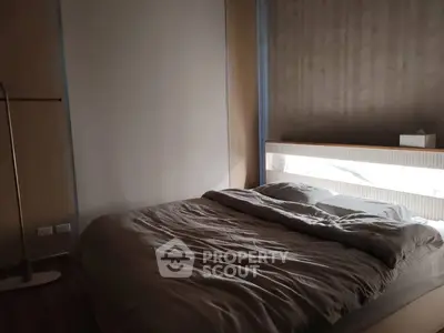 Cozy modern bedroom with stylish decor and soft lighting