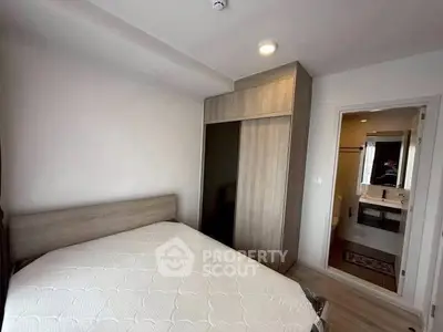 Modern bedroom with ensuite bathroom and built-in wardrobe