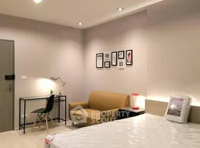 Modern bedroom with stylish decor and cozy seating area