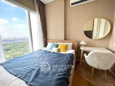 Cozy bedroom with stunning city view, modern decor, and natural light.