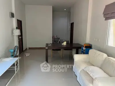 Spacious living room with modern furniture and natural lighting