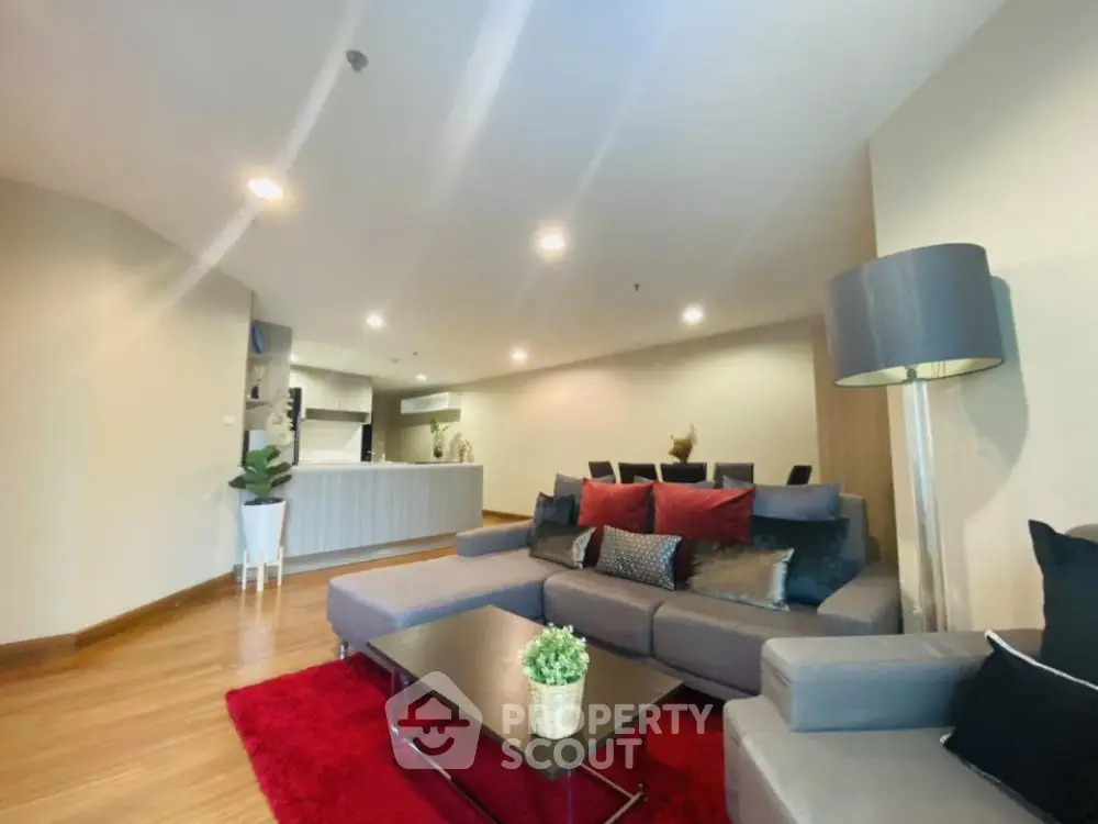 Spacious modern living room with open kitchen and stylish decor
