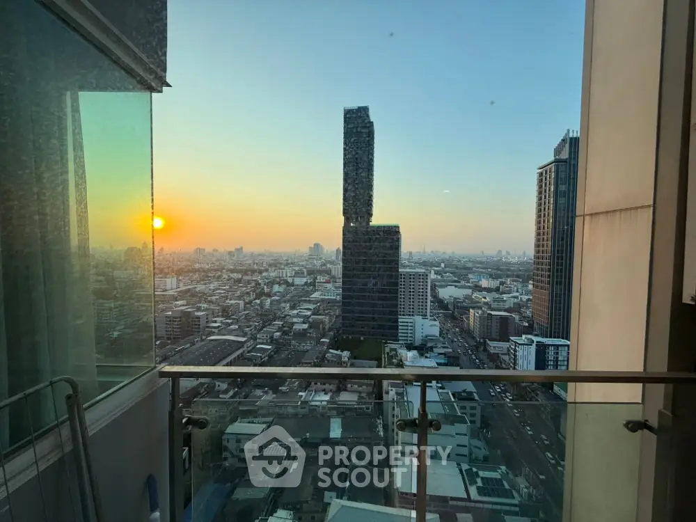Stunning cityscape view from a high-rise balcony at sunset, perfect for urban living enthusiasts.