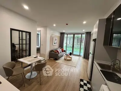 Modern open-plan living room with stylish decor and garden view