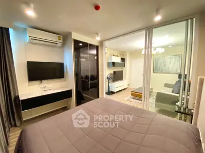 Modern bedroom with sleek design and integrated living area