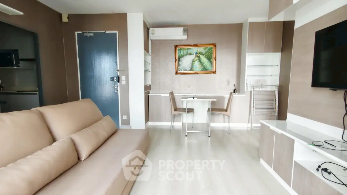 Modern living room with sleek furniture and elegant decor in a stylish apartment.