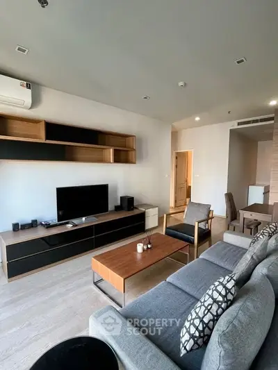 Modern living room with stylish furniture and entertainment center