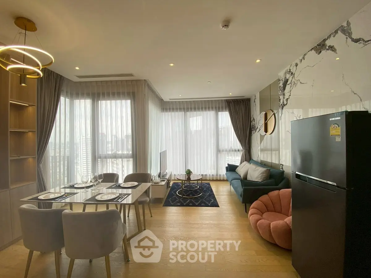 Modern living room with elegant decor and open kitchen layout