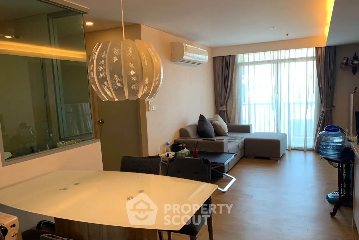 Modern living room with stylish lighting and cozy seating area