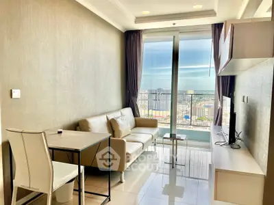 Modern living room with balcony and city view, featuring sleek furniture and natural light.