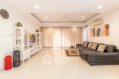 Spacious modern living room with elegant decor and ample natural light