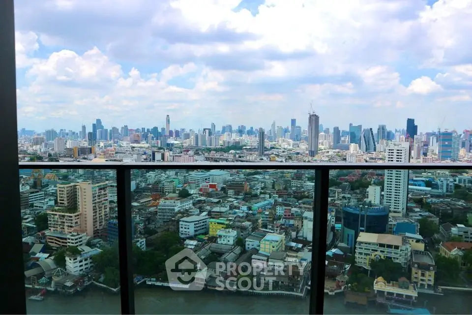 Stunning cityscape view from a high-rise balcony overlooking a vibrant urban skyline.