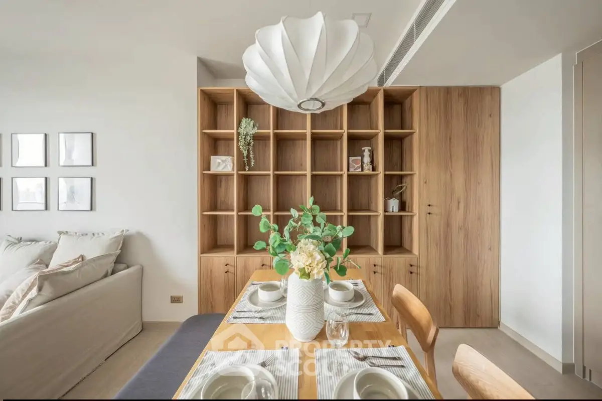 Modern dining area with elegant wooden shelving and stylish decor