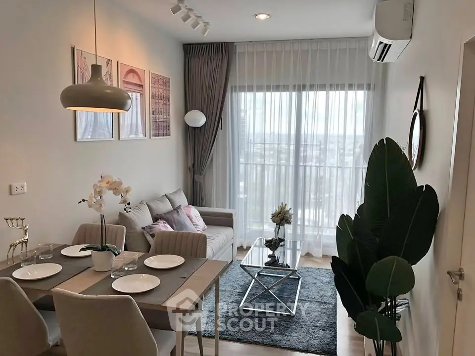 Modern living room with elegant decor and city view, featuring cozy seating and dining area.