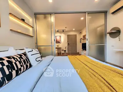 Modern bedroom with sliding doors and stylish decor in a cozy apartment