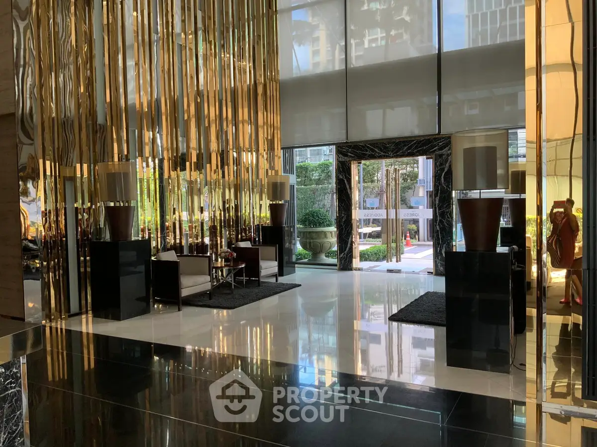 Luxurious building entrance with modern decor and elegant lighting