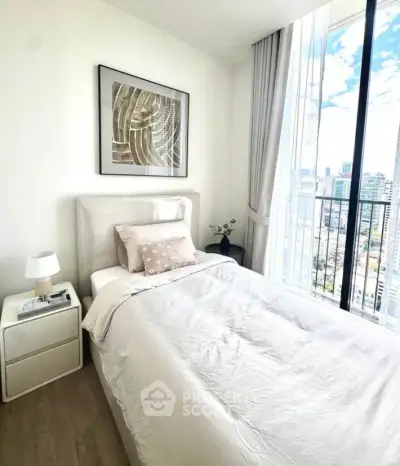 Bright and cozy bedroom with city view, featuring modern decor and floor-to-ceiling windows.