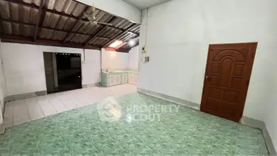 Spacious interior with tiled flooring and open kitchen layout, ideal for customization.