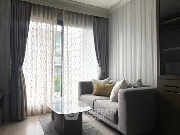 Cozy living room with modern sofa and elegant curtains in a stylish apartment.