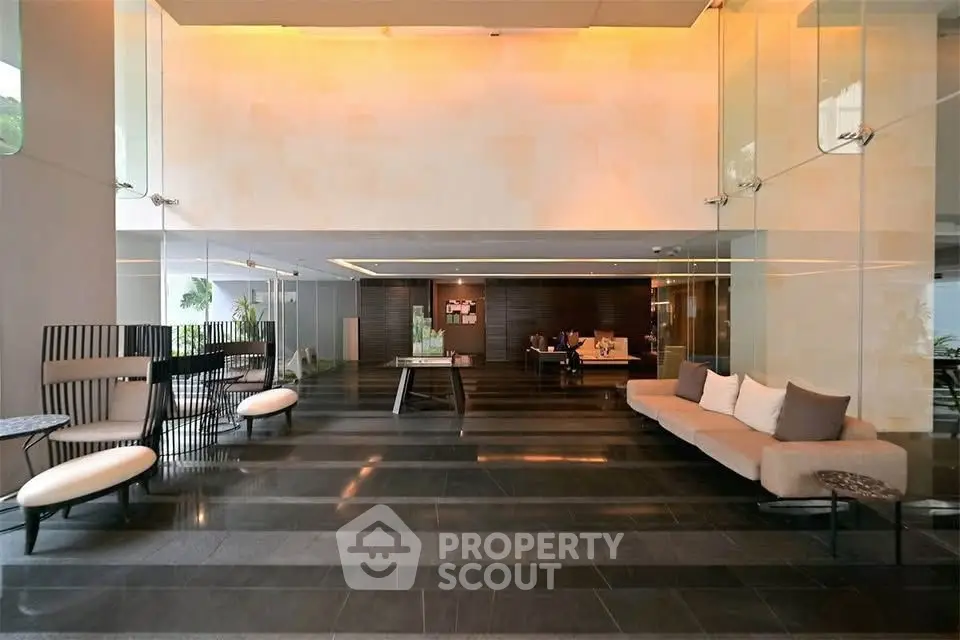 Luxurious modern lobby with elegant seating and glass walls