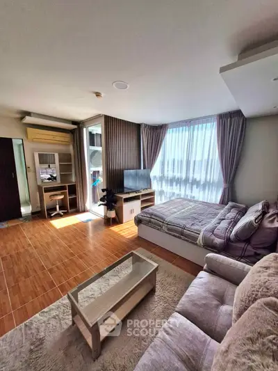 Spacious modern living room with large windows and stylish decor