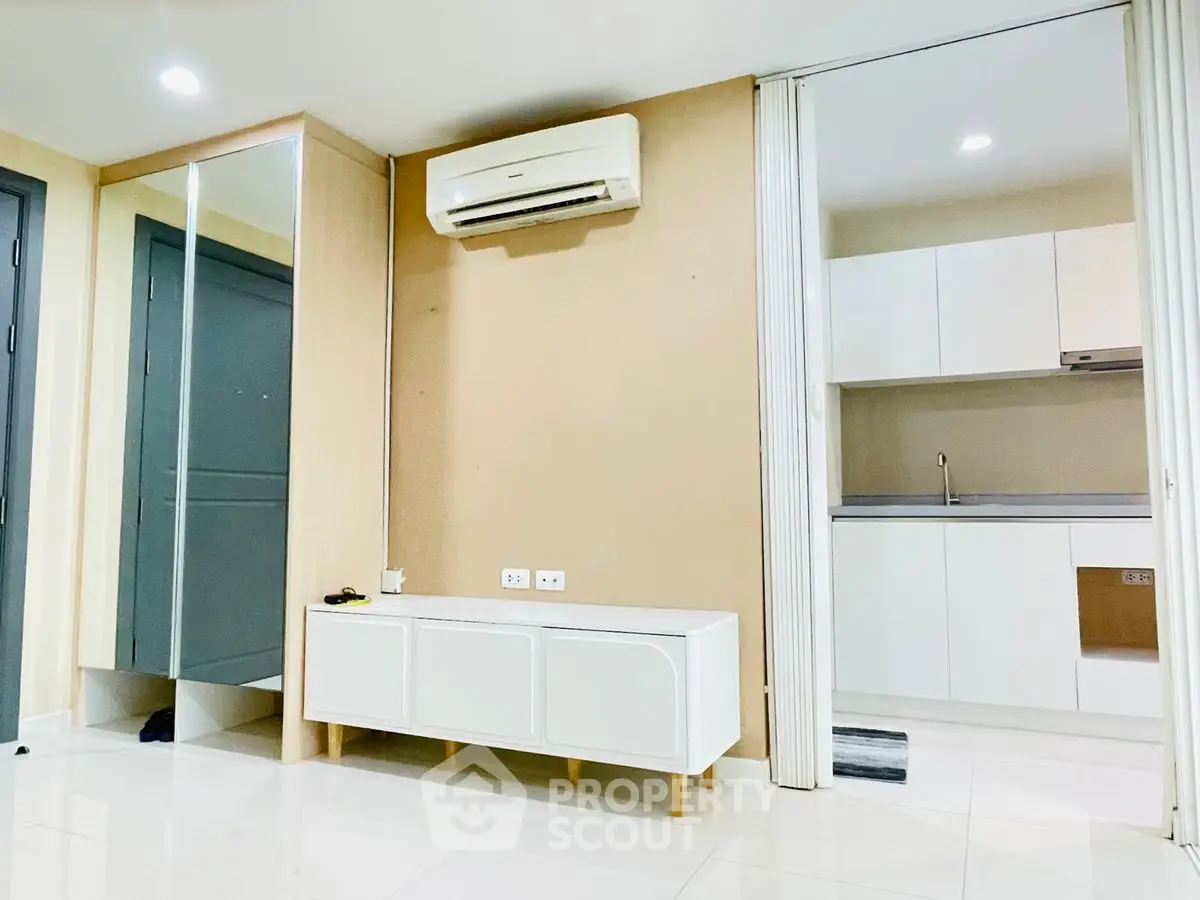 Modern interior with air-conditioned living space and sleek kitchen design.