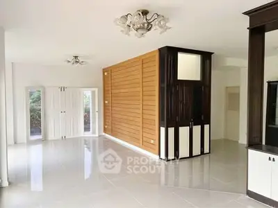 Spacious modern living room with elegant lighting and large windows