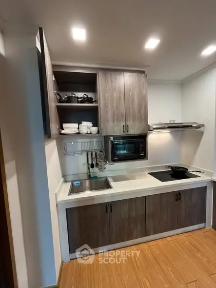 Modern kitchen with sleek cabinetry and built-in appliances