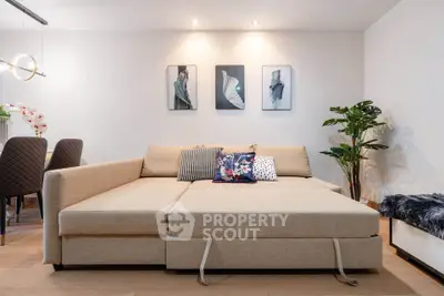 Stylish living room with modern beige sofa and elegant decor