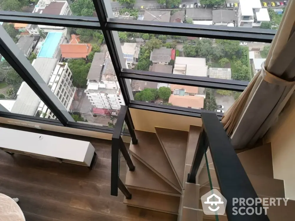 Stunning high-rise view from modern staircase with floor-to-ceiling windows