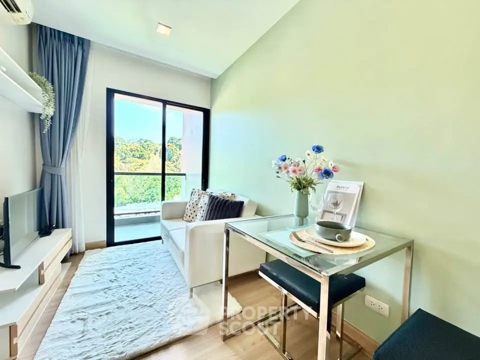 Charming living room with balcony view, modern decor, and natural light in a cozy apartment.