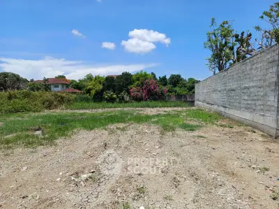 Spacious vacant land with lush greenery, perfect for development opportunities.