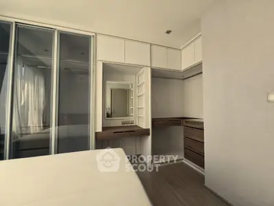 Modern bedroom with built-in wardrobe and minimalist design
