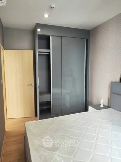 Modern bedroom with sleek wardrobe and minimalist design